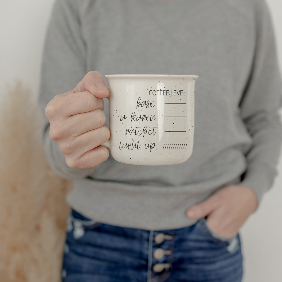 Speckled white mug with coffee attitude tracker